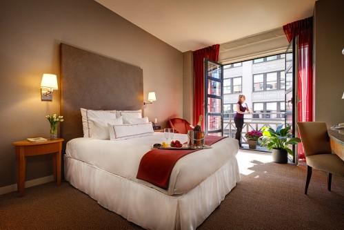 Almost all of our Guestrooms with 1 Queen Bed offer charming Juliet Balconies overlooking 26th street.