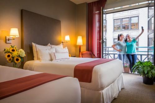 Our Balcony Guestroom with 2 Queen Beds is perfect for friends traveling together!