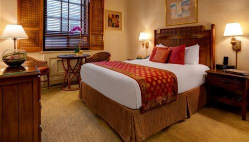 A Petite Room with 1 Queen Bed is perfect for a single traveler or couple.