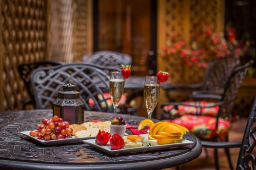 On warmer days, we welcome guests to enjoy our Wine & Cheese Reception in our Blue Parrot Courtyard.